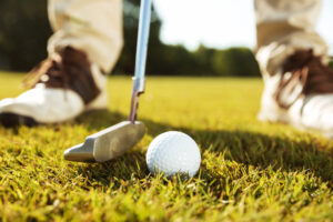 close-up-male-golfer-teeing